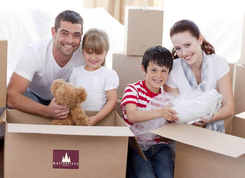 The family packing boxes With kids in Hurst, TX.
