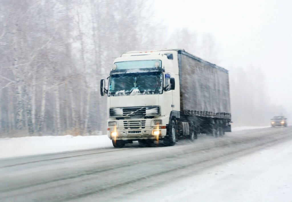 The moving truck in snow fall highway at Hurst, TX