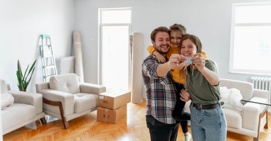 holding keys of their new home