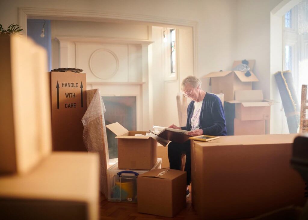 Senior women Packing Goods for a Move