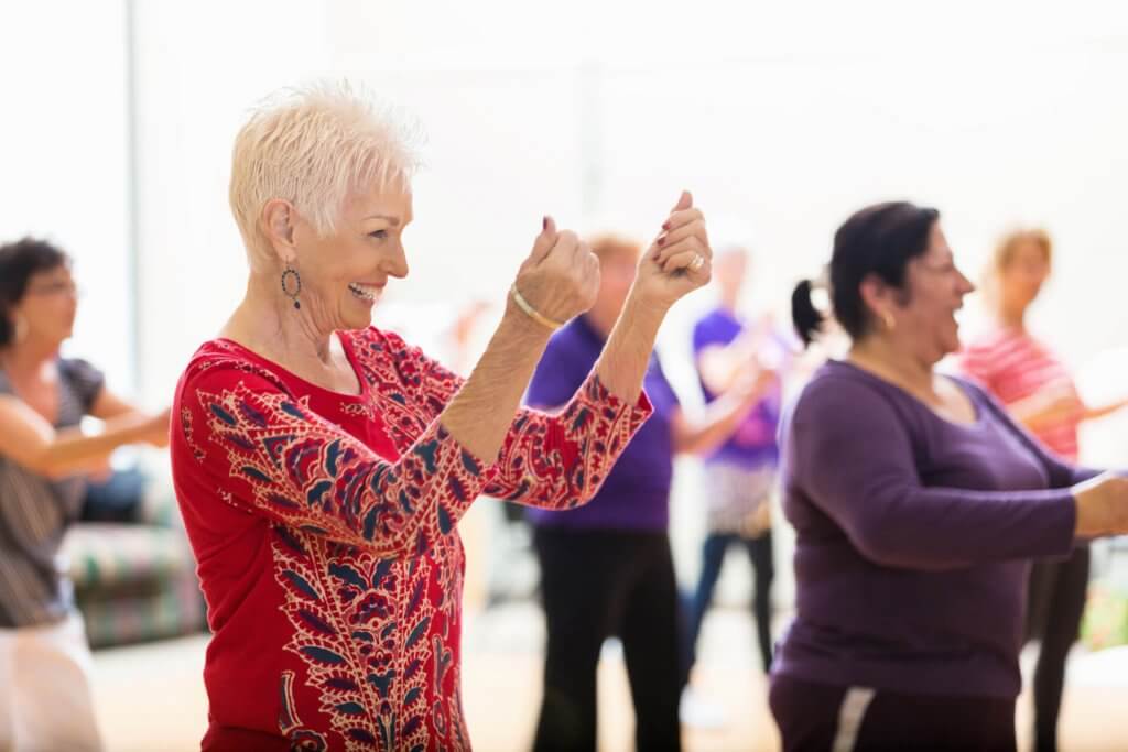 Senior woman enjoys dance class