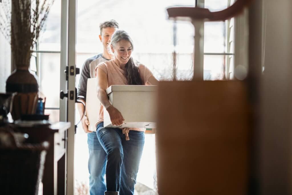 Mature Couple with Moving Boxes in New Home