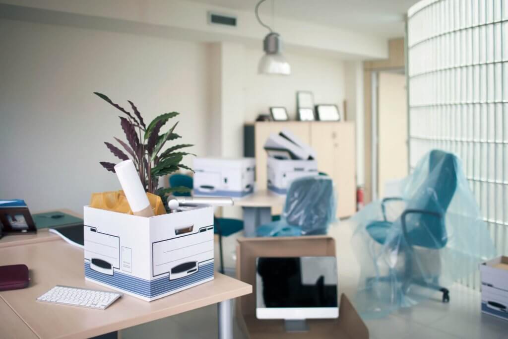 Belongings in box on desk in office