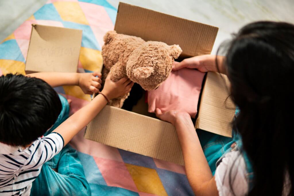 kids packing clothes and toy