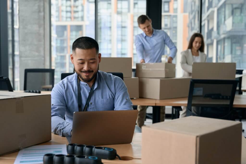 Young corporate employees preparing for office moving